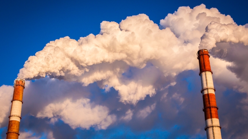 Smokestacks emitting gases