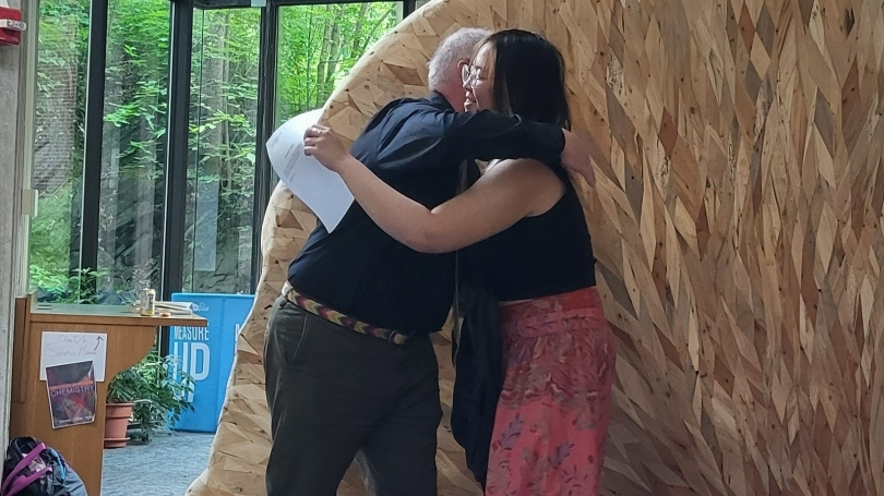 Sheen hugs Professor Chris Sneddon